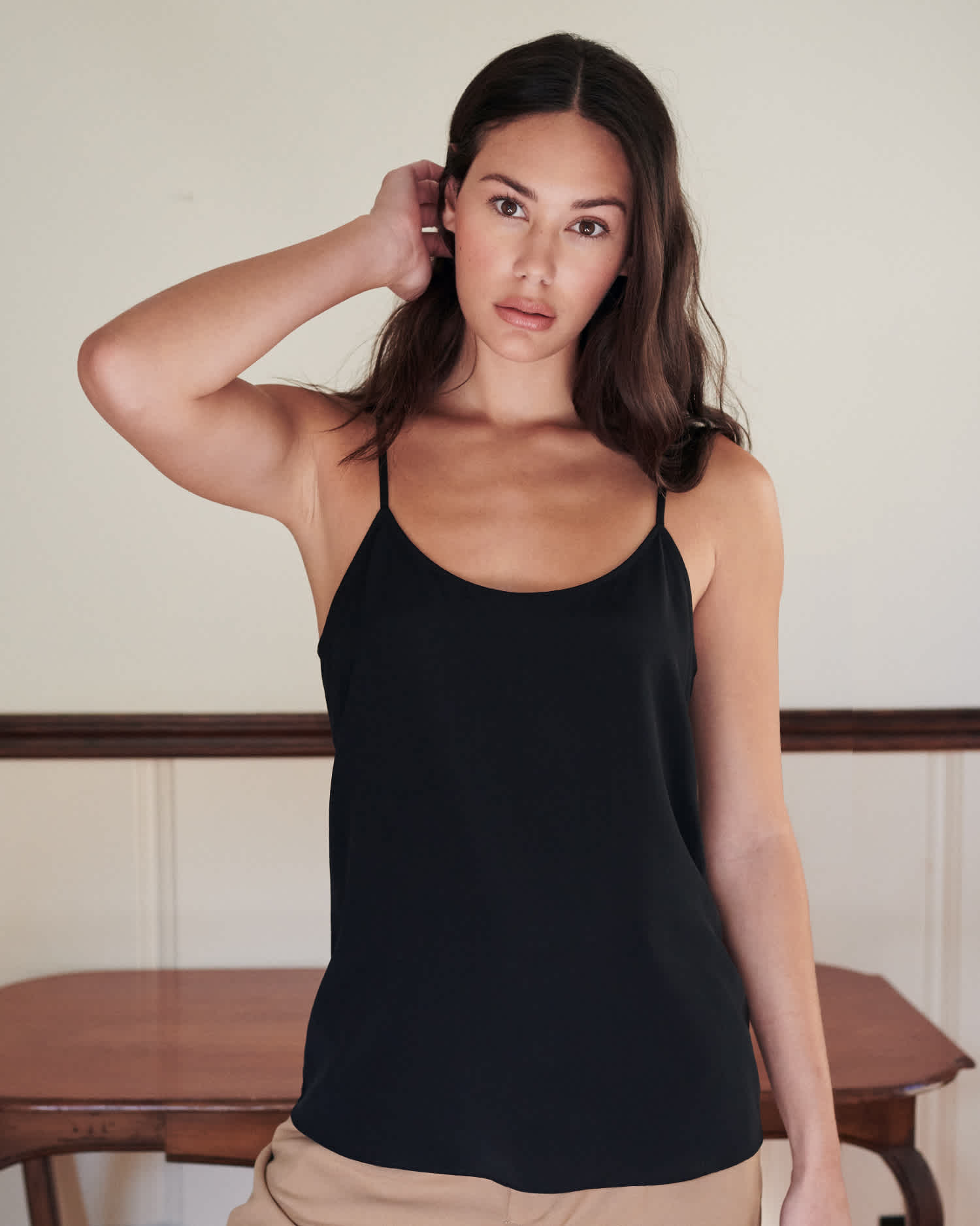 woman wearing silk camisole in black from front