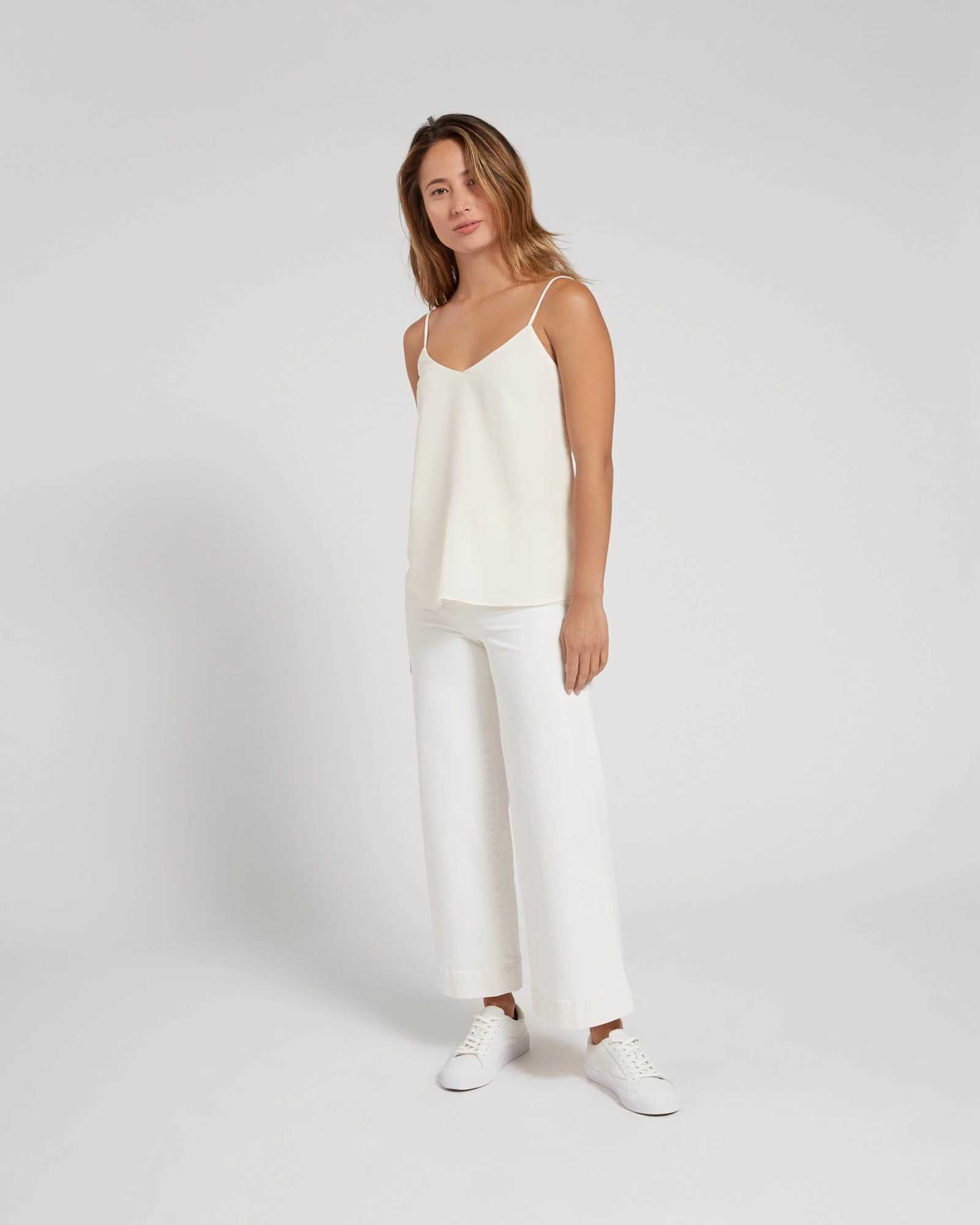 Woman wearing white silk camisole from front