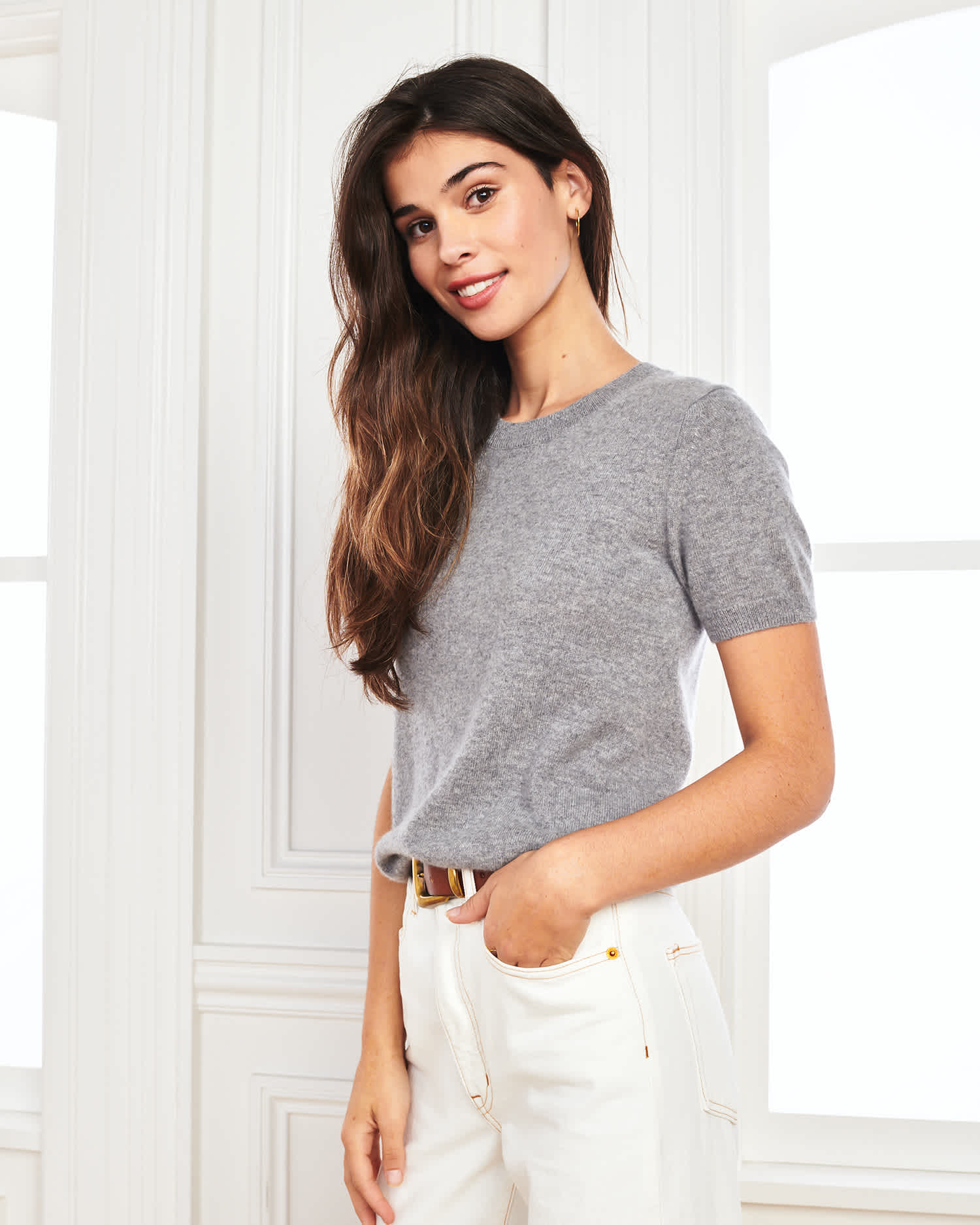 woman wearing grey cashmere tee and short sleeve cashmere sweater angle