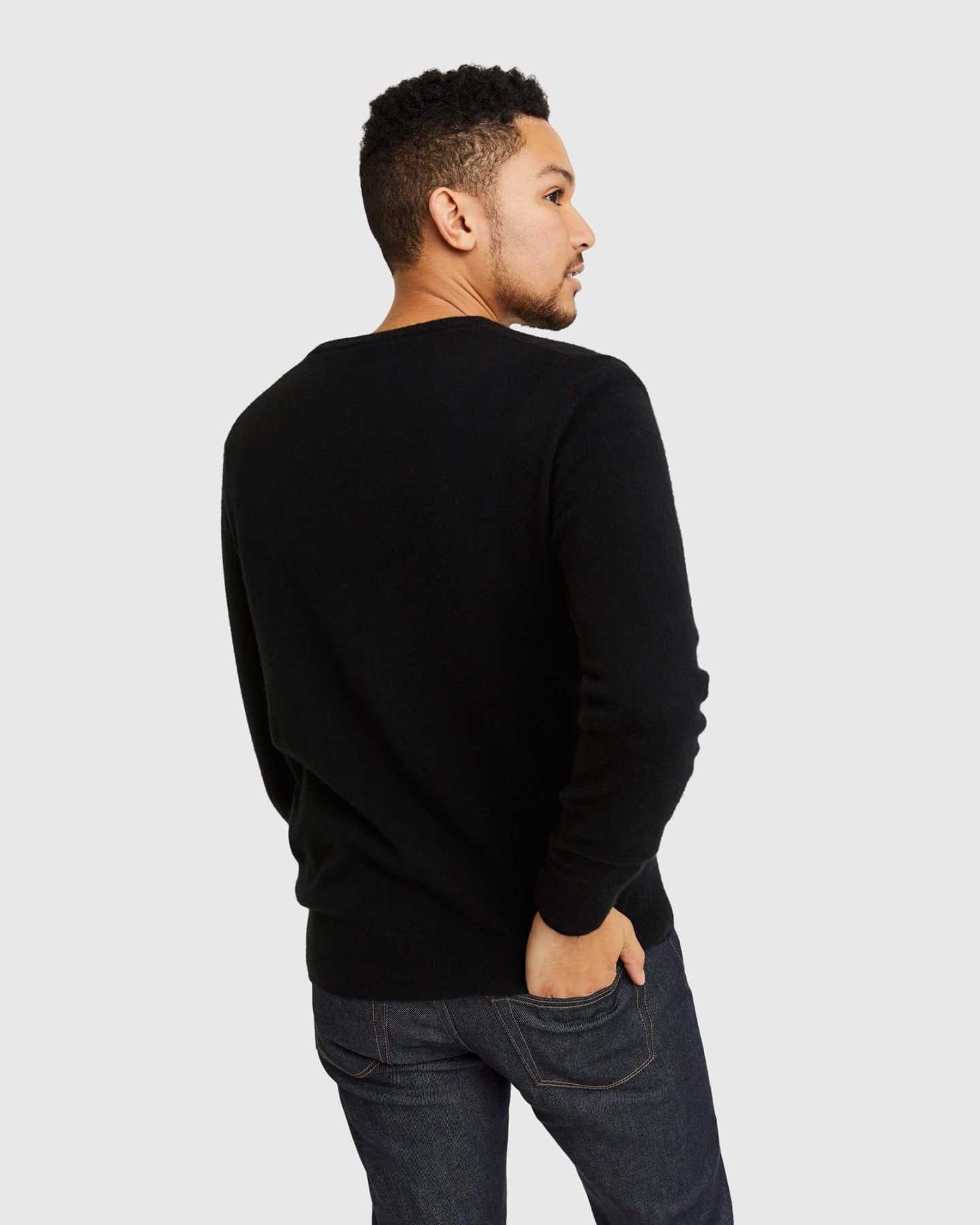 Man wearing black cashmere v-neck sweater for men from behind