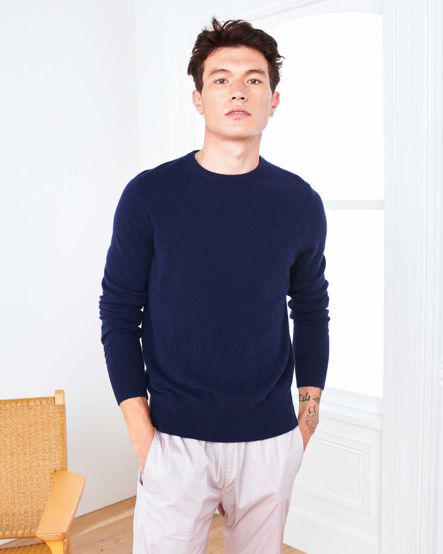 Man wearing navy men's cashmere sweater