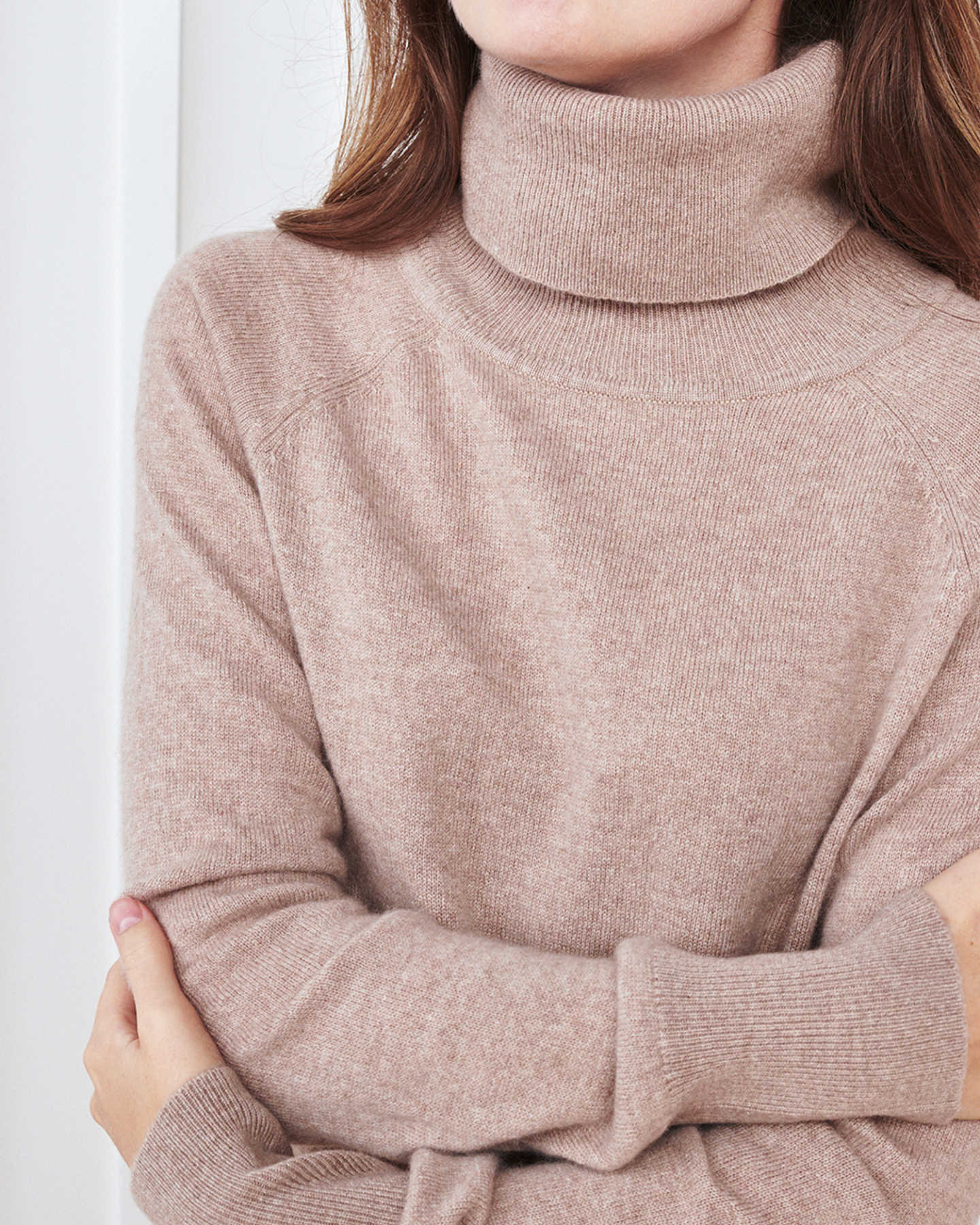 Woman wearing cashmere turtleneck sweater dress