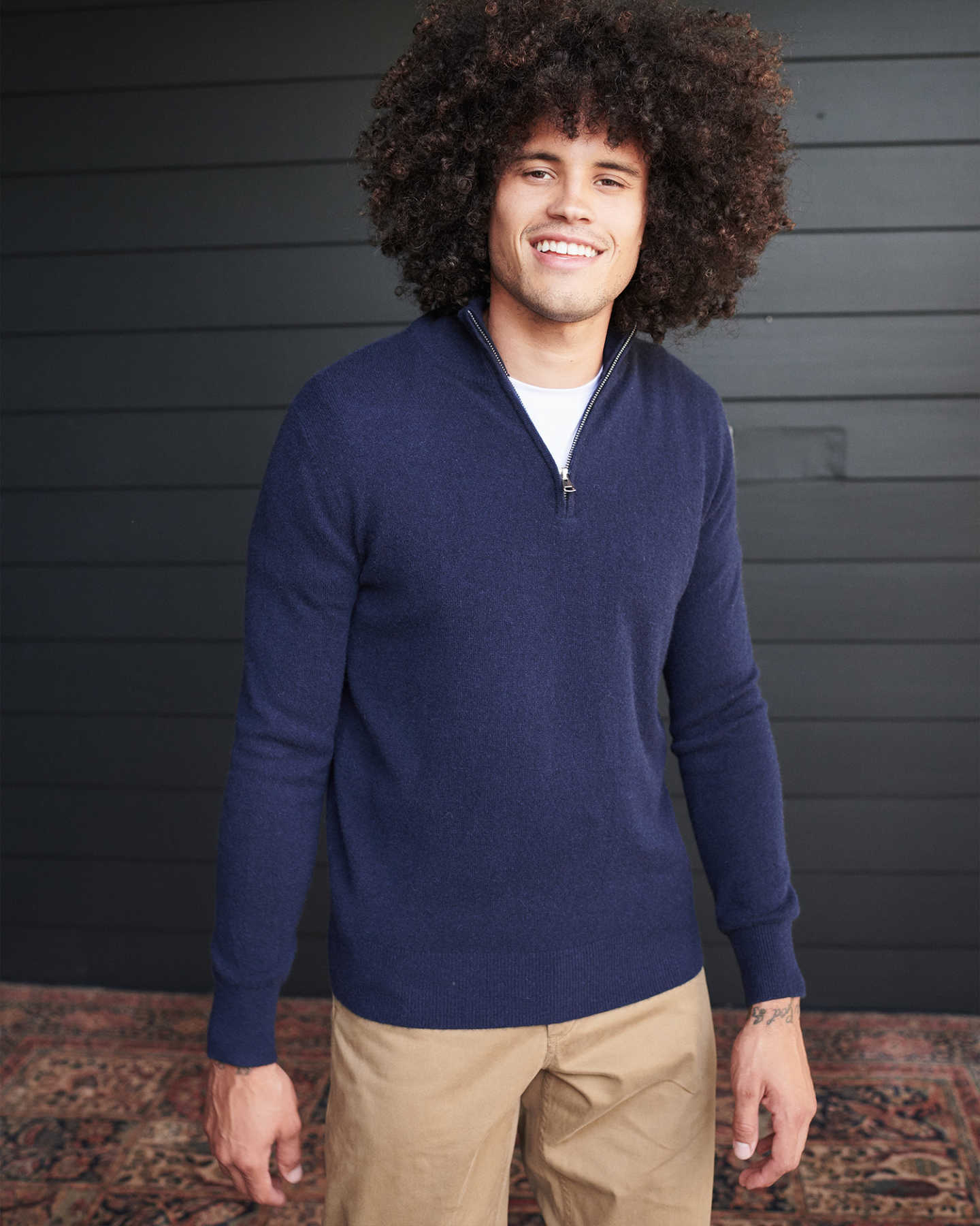 Man wearing navy cashmere quarter zip sweater 
