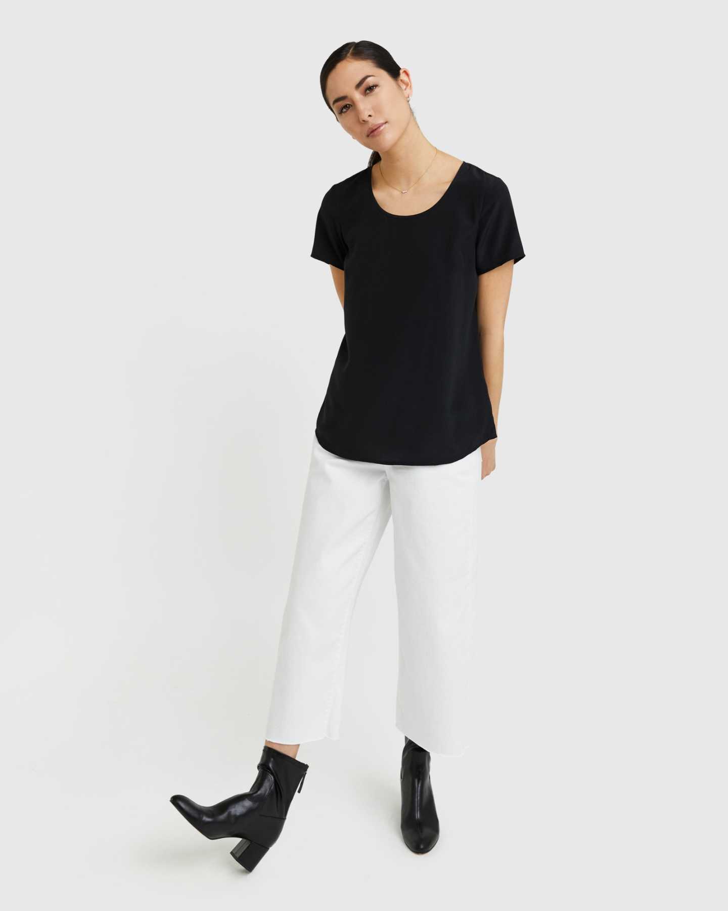 Woman wearing silk tee in black