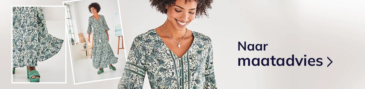 Vrouw draagt een lange jurk met groen en wit paisley-patroon, gecombineerd met groene sandalen; tekst "Zur Größenberatung" rechts in beeld.