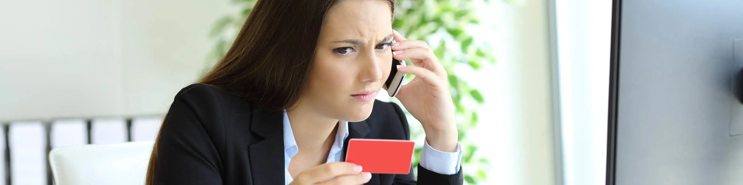 Business woman holding a credit card