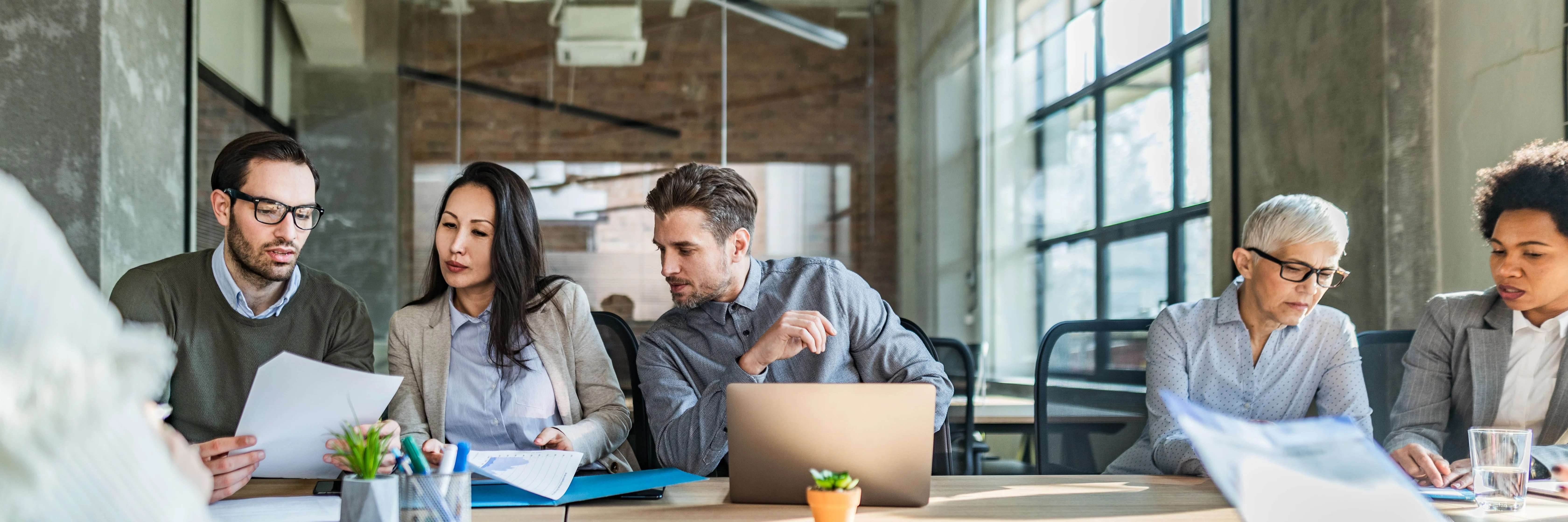 Coworkers collaborating in office.