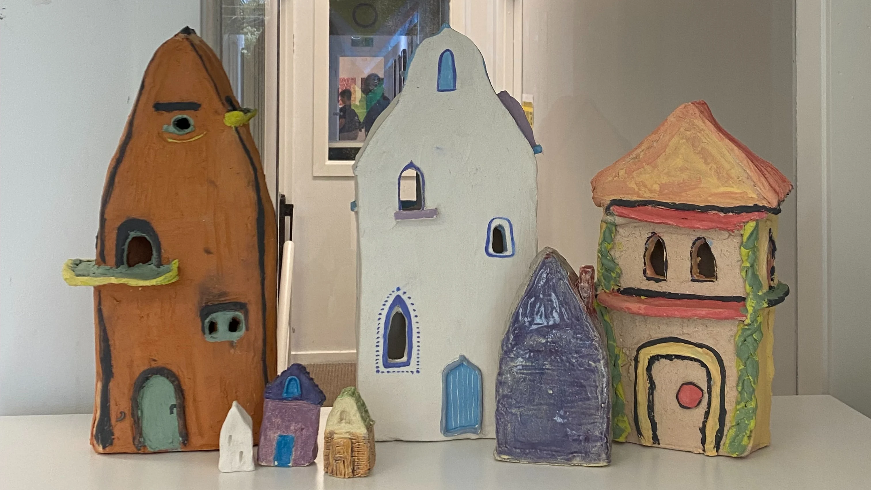 Ceramic houses displayed in the Juno office.
