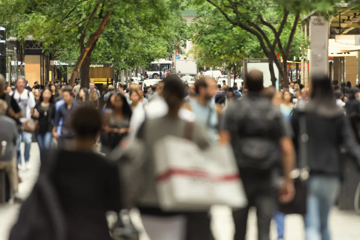 shoppers-walking-down-tree-lined-street