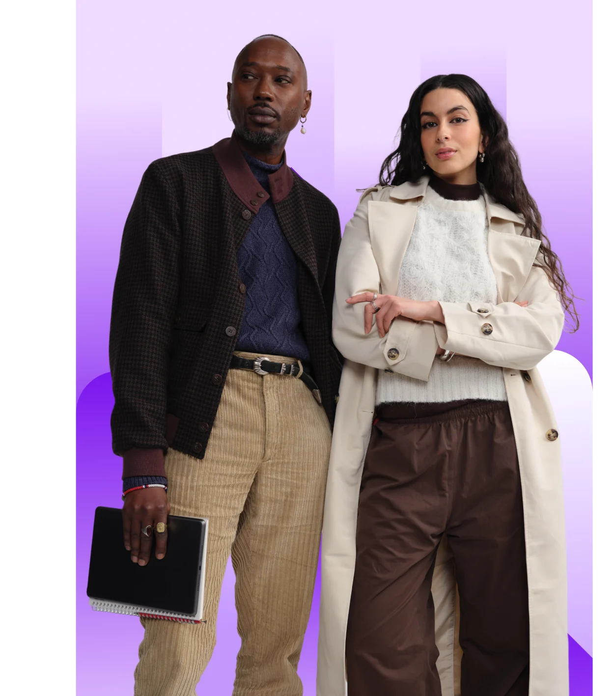 Two professionally dressed, diverse individuals standing side-by-side in front of a purple gradient background. A man in a brown jacket and corduroy pants holds a notebook, and a woman in a trench coat and cream sweater has her arms crossed.