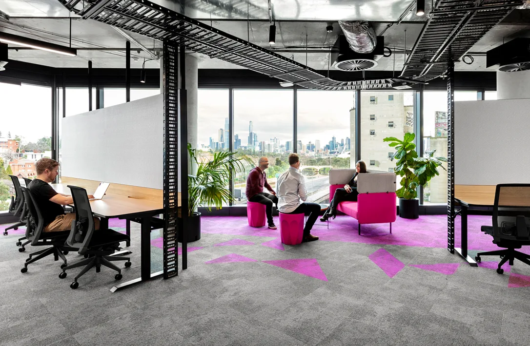MYOB employees working and collaborating in the MYOB Cremorne Office.
