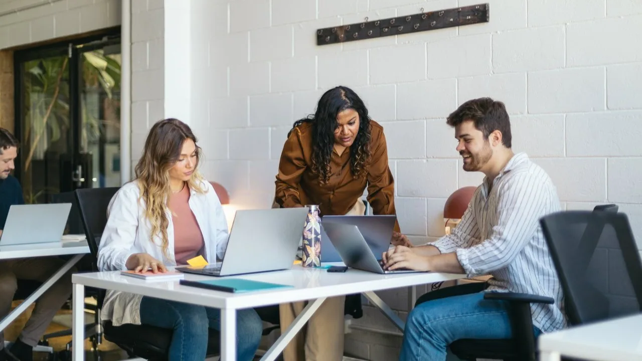 Coworkers meeting in modern office