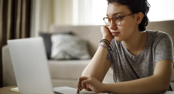 Image of a women on her laptop