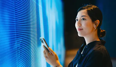 female engineer looking at computers