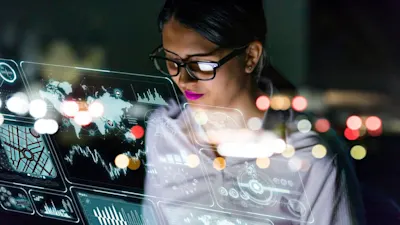 female engineer looking at computers