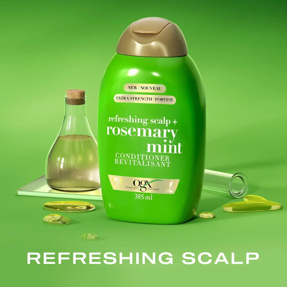 Front shot of OGX® Rosemary Mint Extra Strength Conditioner, 385 mL with a laboratory  tube and bottle