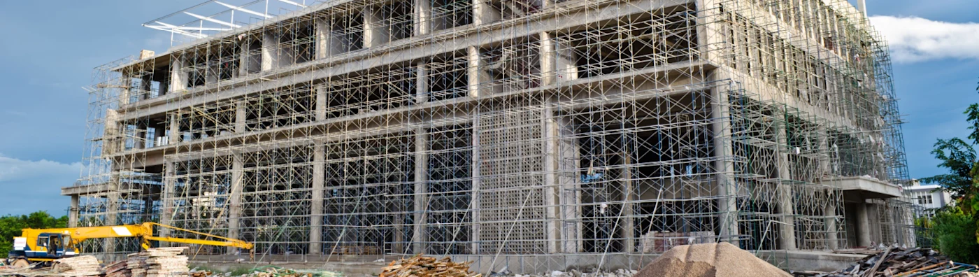 A business building is under construction, protected by a surety bond.