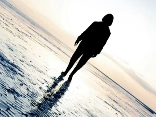 Mental Health Banner Image - Silhouette of a person on a beach