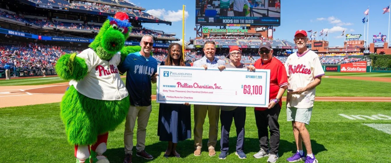 Philadelphia Insurance Companies presents a check of $63,100 to Phillies Charities, Inc.