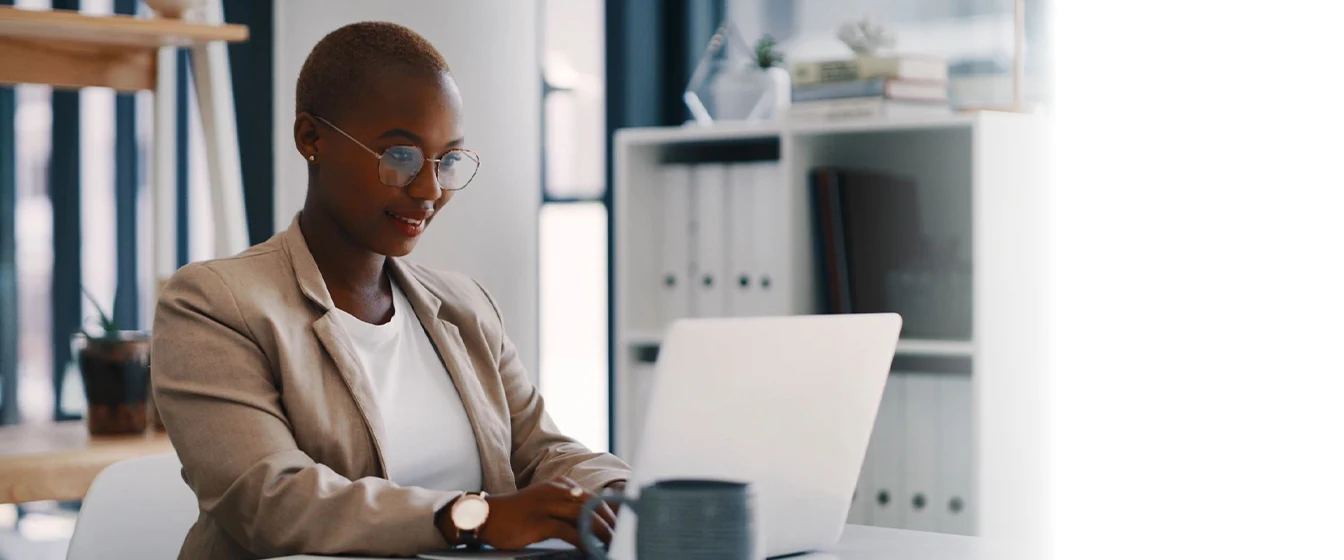 Woman works on a laptop. Text overlay: Electronic Binding