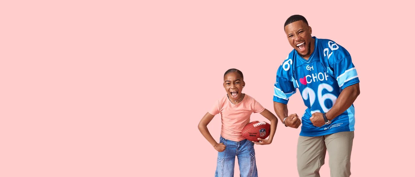 Saquon Barkley and CHOP patient flexing.
