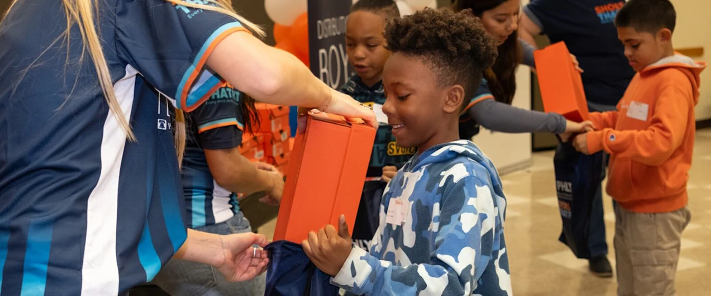 Kid at Shoes That Fit event