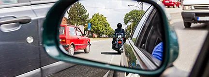 Motorcycle reflected in rearview mirror