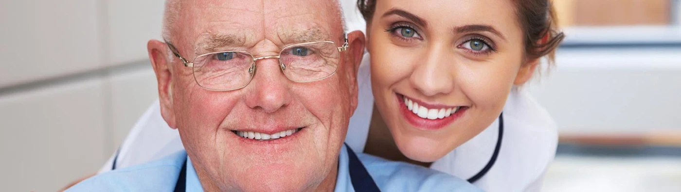 Image of a young female nurse with an older male patient
