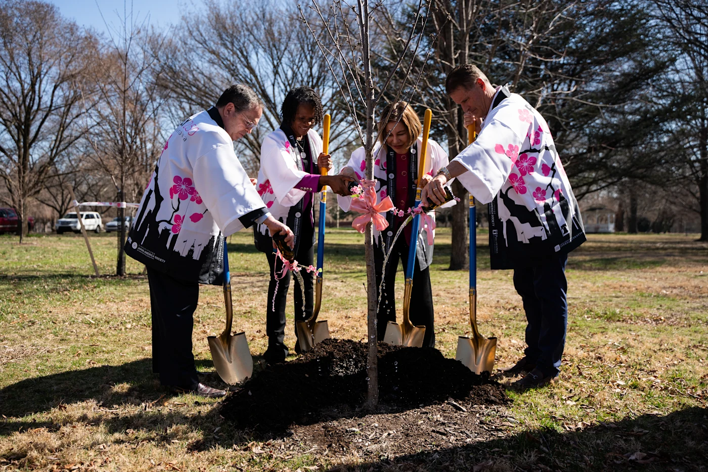PHLY executives and Japan America Society of Greater Philadelphia plant a gifted cherry tree.