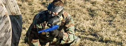 Man in cameo in a paintball facility.