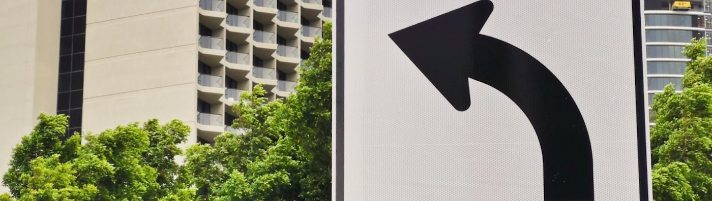 Street sign with left-turn arrow and the word “only” underneath.