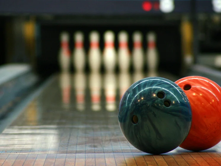 Bowling lane with pins and bowling balls