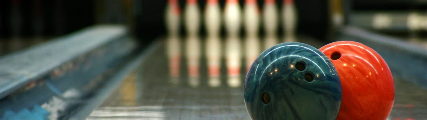 Bowling lane with pins and bowling balls