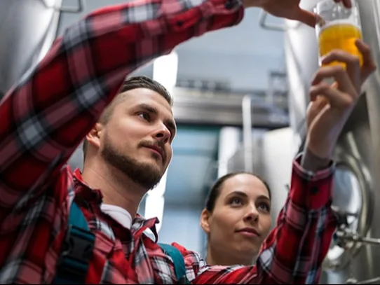 Man holding a glass of beer