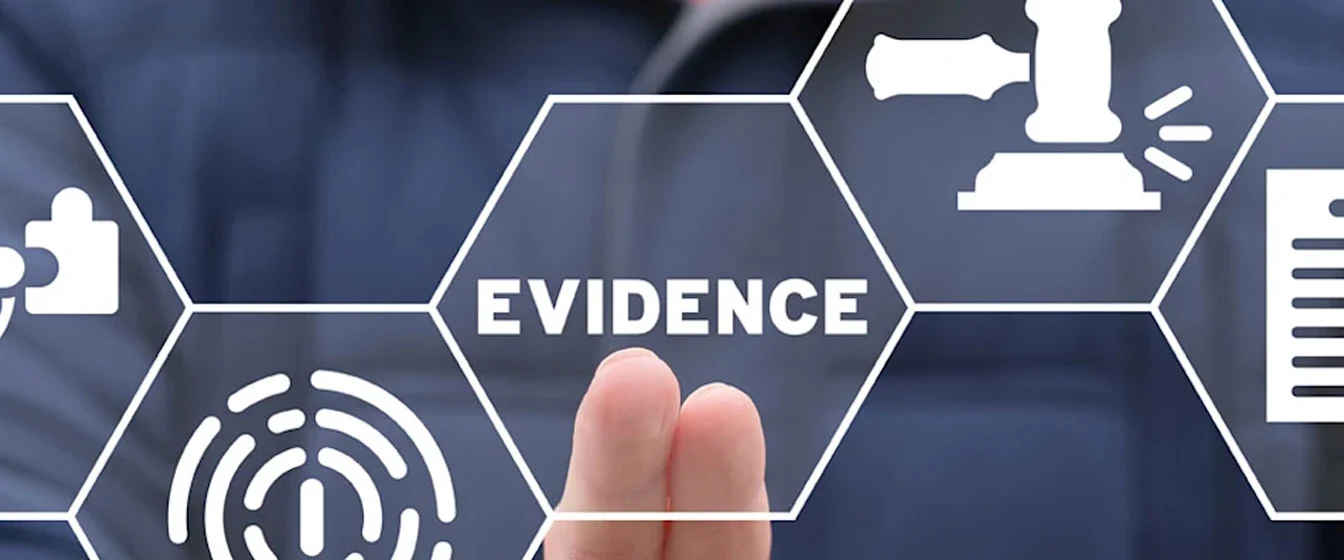A person in dark clothing touching a virtual screen with icons for evidence and law.