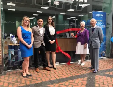 Explore Learning staff stood outside the Watford centre as local dignitaries cut the ribbon to symbolise the opening of the centre. 