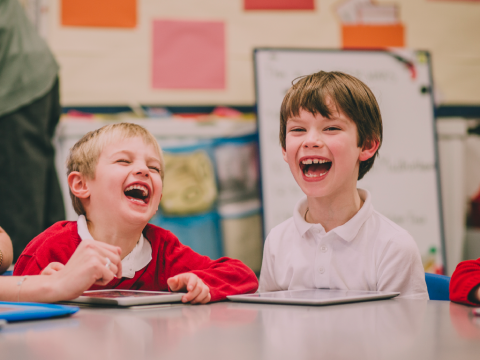 Friends laughing in school