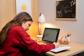 A girl working during her online tuition lesson with Explore Learning