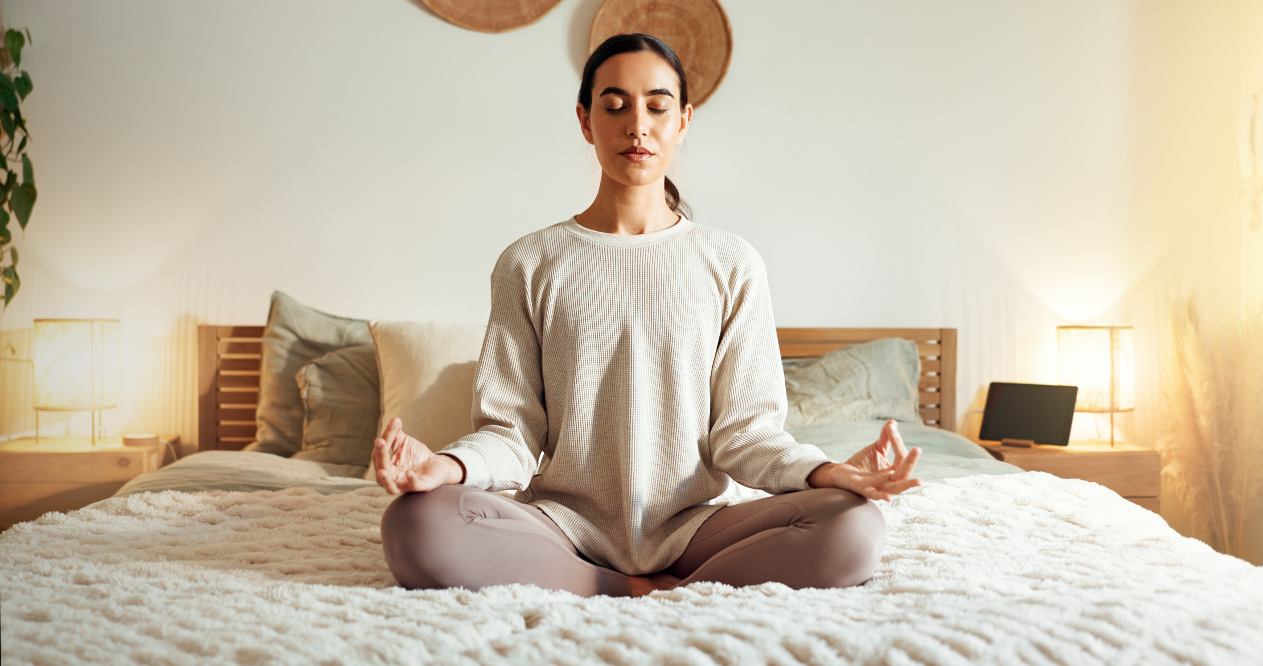 person wearing activewear meditating