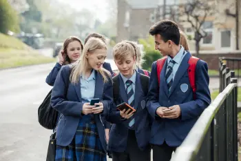 Children in school uniform walking and checking their results