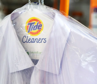 A clean shirt cleaned by professional cleaners with the Tide Cleaners logo