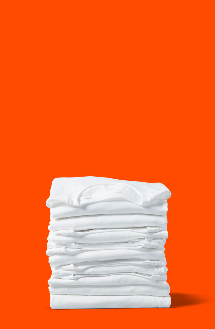A pile of folded white clothes