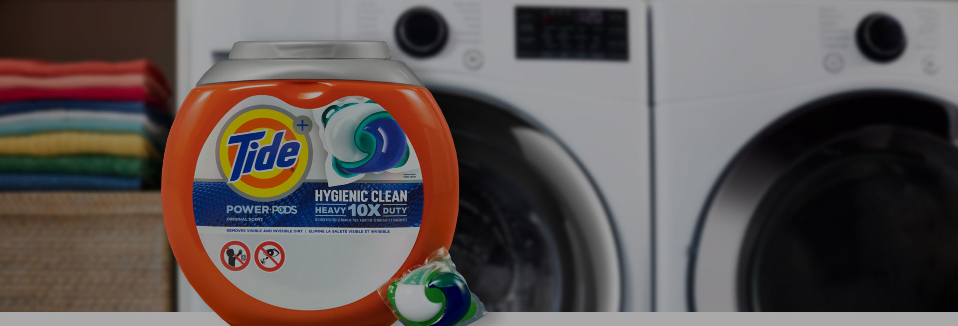 Tide Hygienic Clean Heavy Duty 10x Power PODS in front of a washer