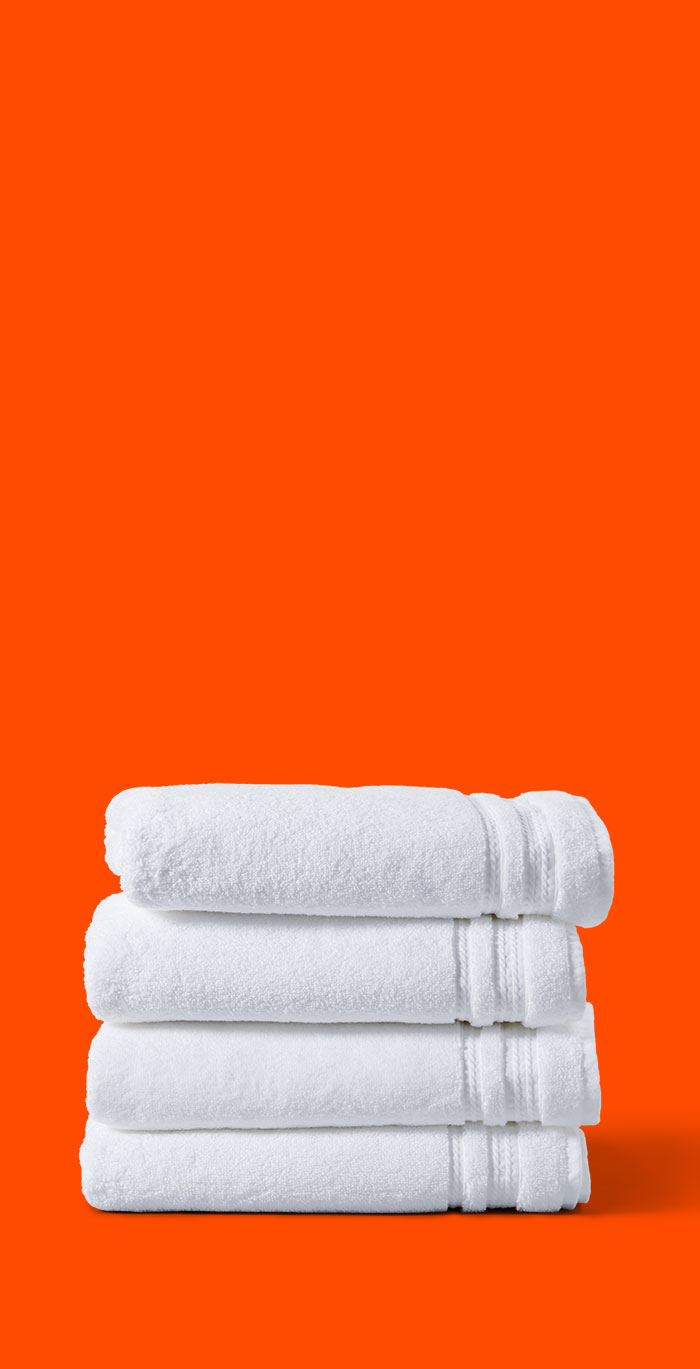 A pile of folded white towels