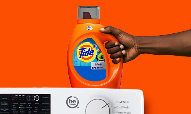 Tide Plus Febreze Sport Odor Defense™ Liquid Laundry Detergent on a washing machine