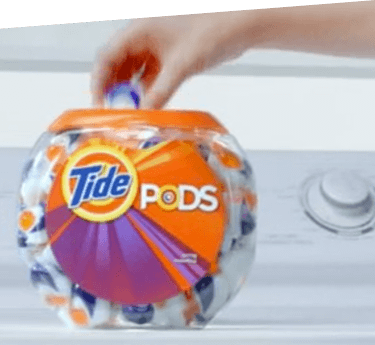 A see-through container full of Tide PODS capsules