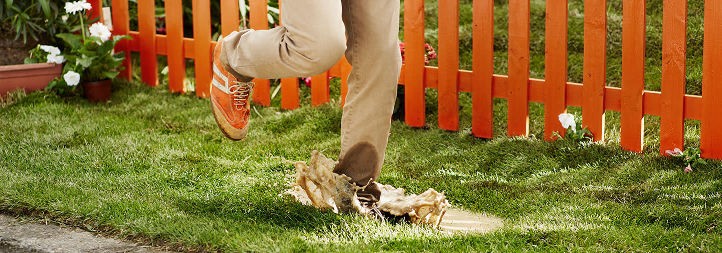 A person stepping into a puddle