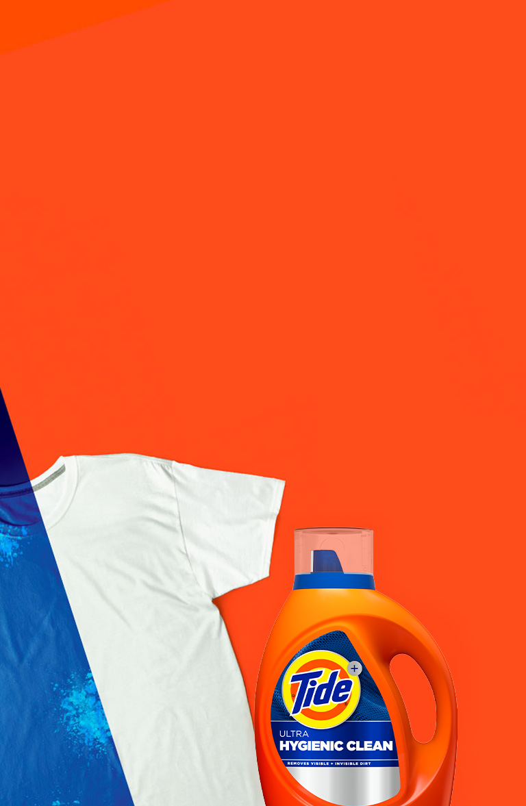 A stained white t-shirt under UV light and a bottle of Tide Hygienic Clean Heavy Duty 10x Liquid Detergent