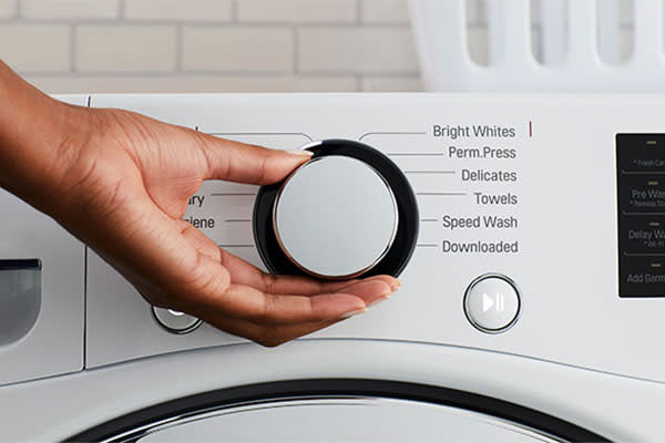 Select the wash cycle and water temperature on your washing machine