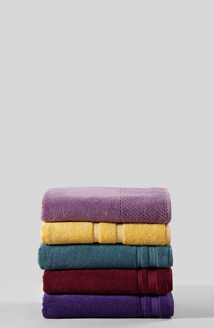 A pile of folded colorful towels